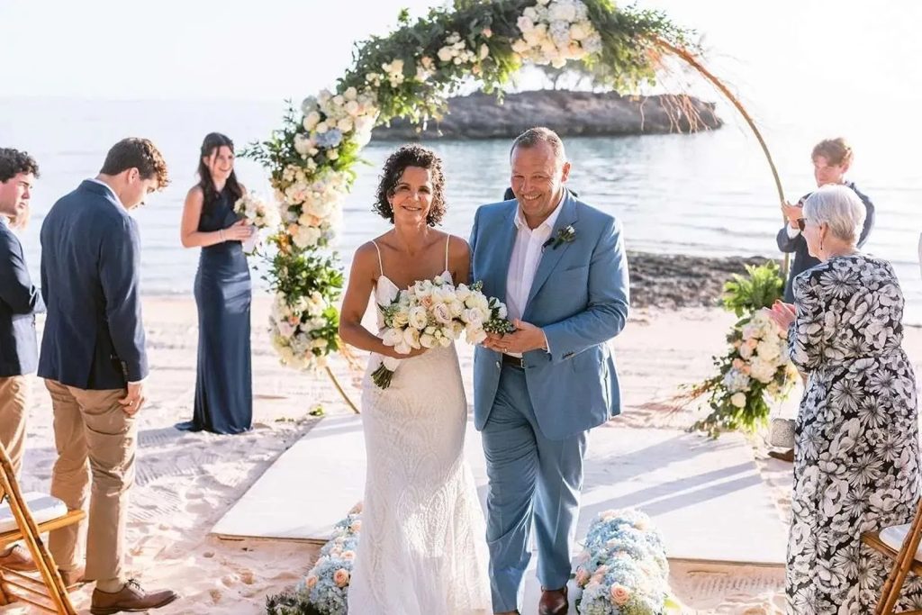 Bride and groom smile after beach wedding ceremony on Bahamas private island