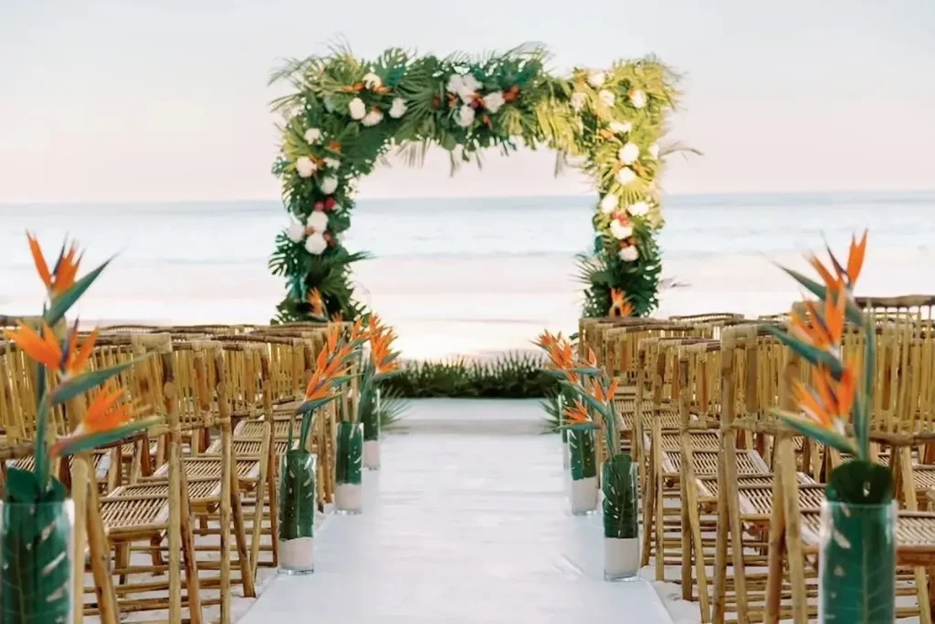 beachfront ceremony site in the bahamas with tropical foliage