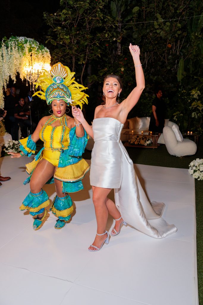 Bride with Junkanoo dancer in the Bahamas