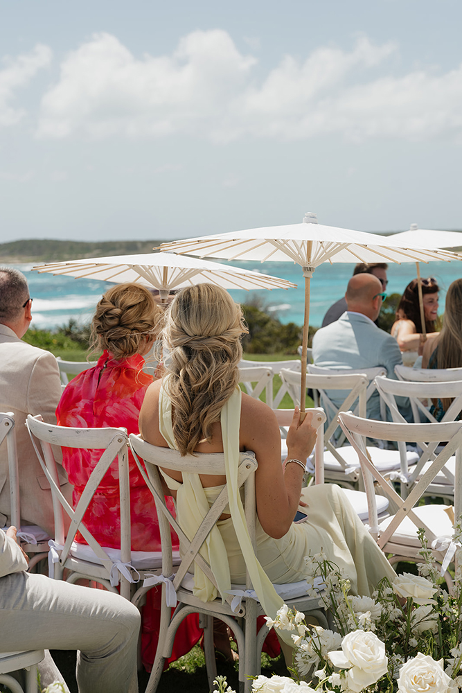 Parasols shaded guests during Bahamas Eleuthera wedding ceremony