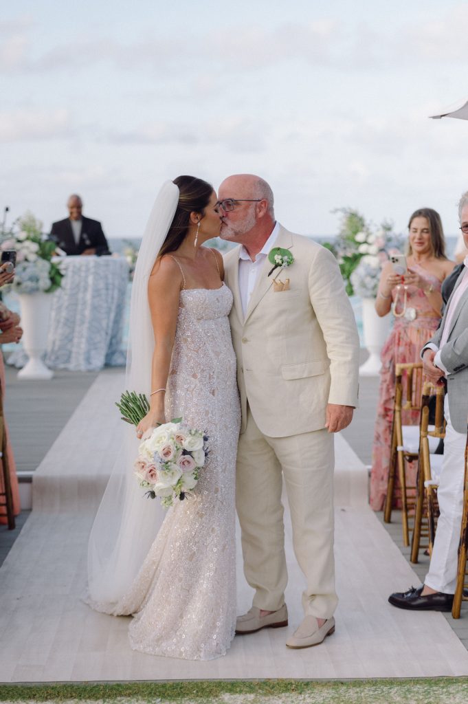 Bride and Groom kiss at The Potlatch Club wedding ceremony Eleuthera, Bahamas