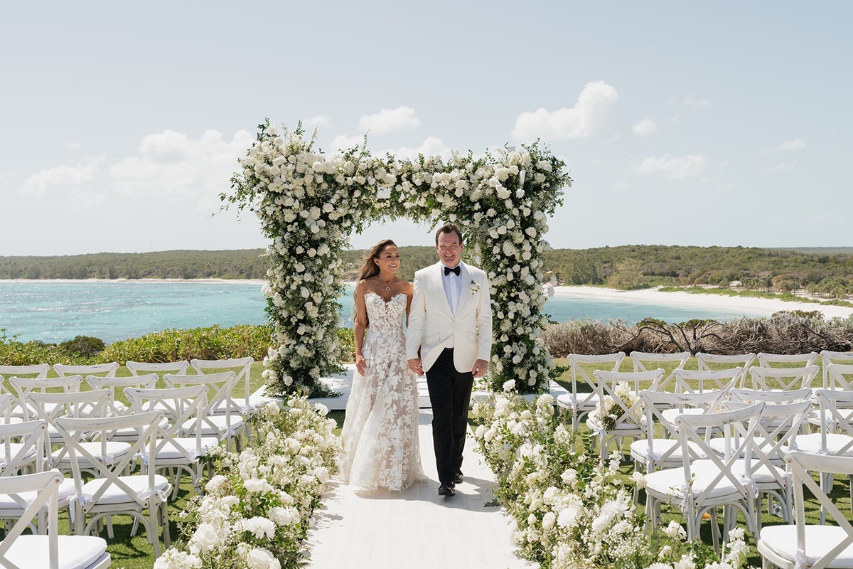 Bride and groom walking the aisle at Jack's Bay Club wedding venue in Eleuthera