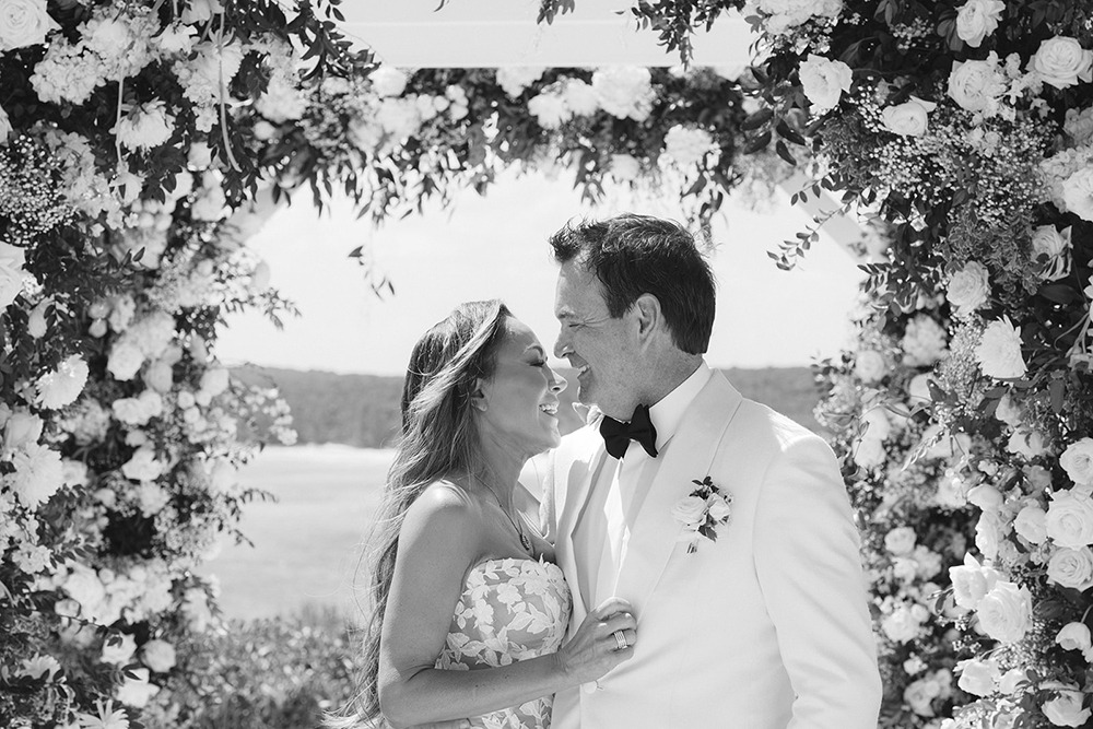 Newlyweds embrace during Jack's Bay Club wedding ceremony