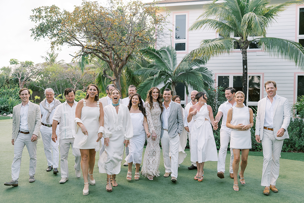 Group shot of 14 people during multi-day Harbour Island wedding organized by Chic Bahamas Weddings